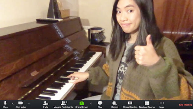 Piano teacher showing how to set up for an online piano lesson over Zoom