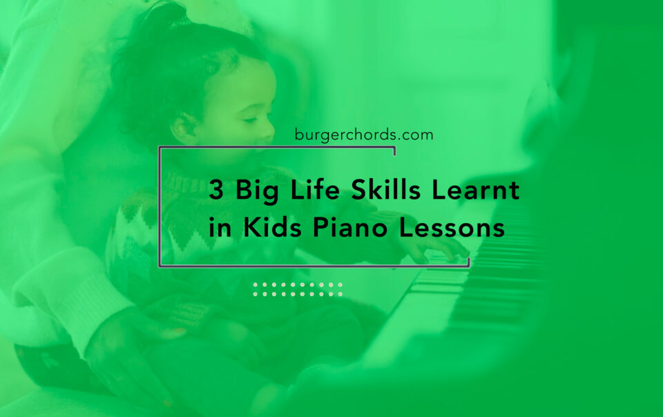 toddler having a kids piano lesson and pressing keys with their tiny fingers